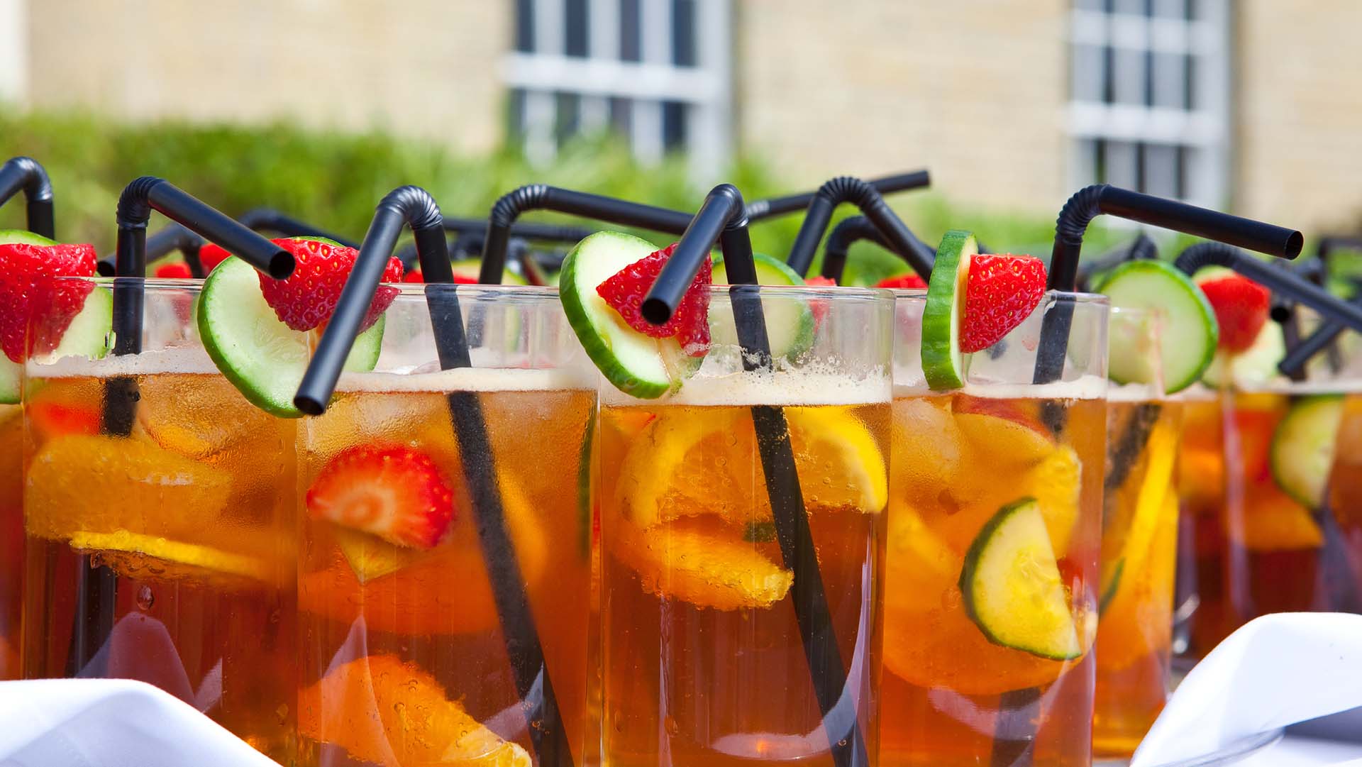Glasses of Pimms on white tablecloth at garden party